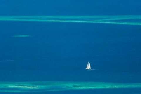 Sailboat navigating the waters of Southern Belize, with Lighthawk, Belize